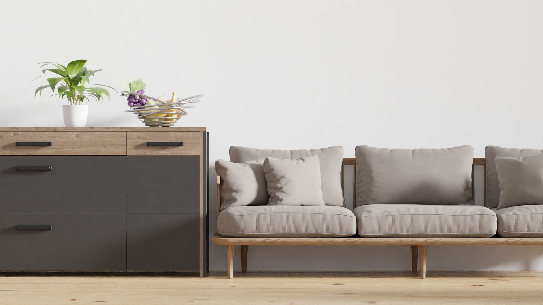 Contemporary living room with light gray sofa, wooden sideboard with potted plant, and minimalist decor