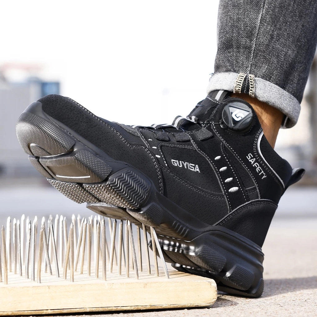 Person wearing black safety boots standing on spiked surface, demonstrating puncture-resistant sole